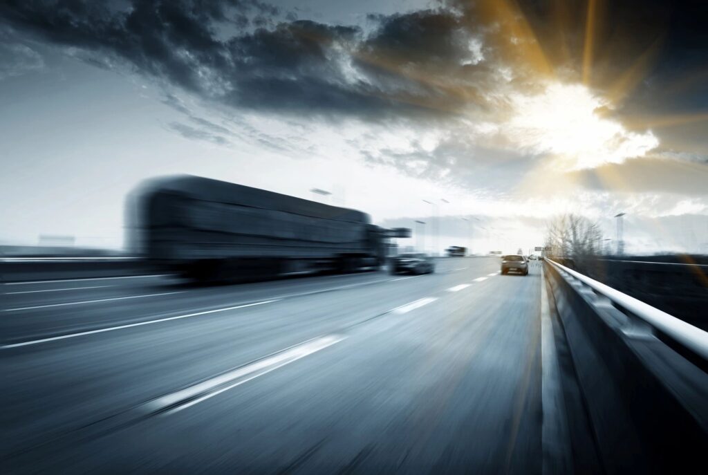 Londonderry Truck Accident Lawyer features photo of truck speeding down new hampshire highway 