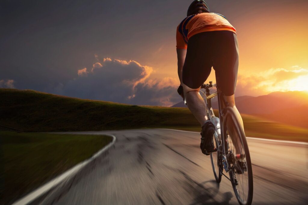 Londonderry Bike Accident Lawyer photographs cyclist on new hampshire road at sunset